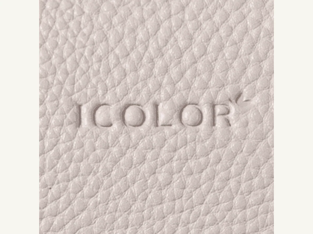 Debossing logo process for leather-look and structured tote details
