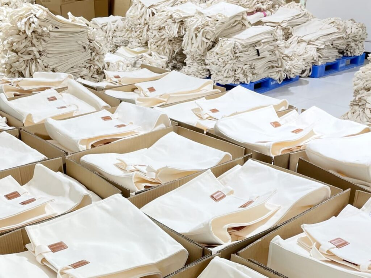 GWP tote packaging brief with kraft card rPET route and polybag planning