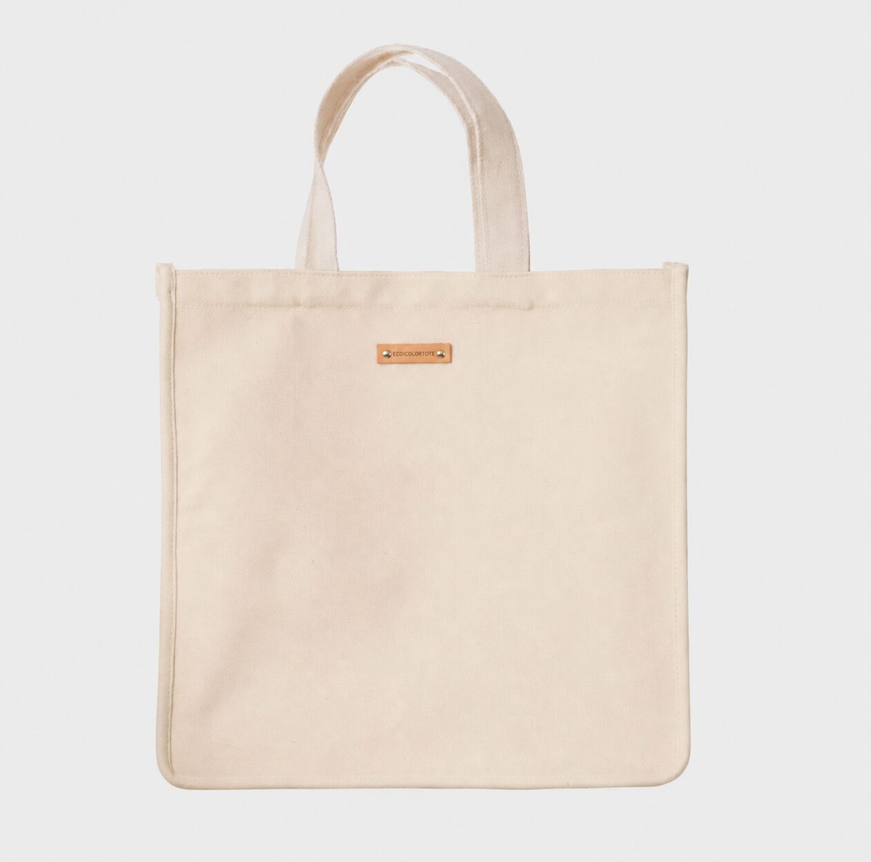 Initial 16 oz cotton canvas GWP tote sample with 30 cm handles before adjustment to 60 cm