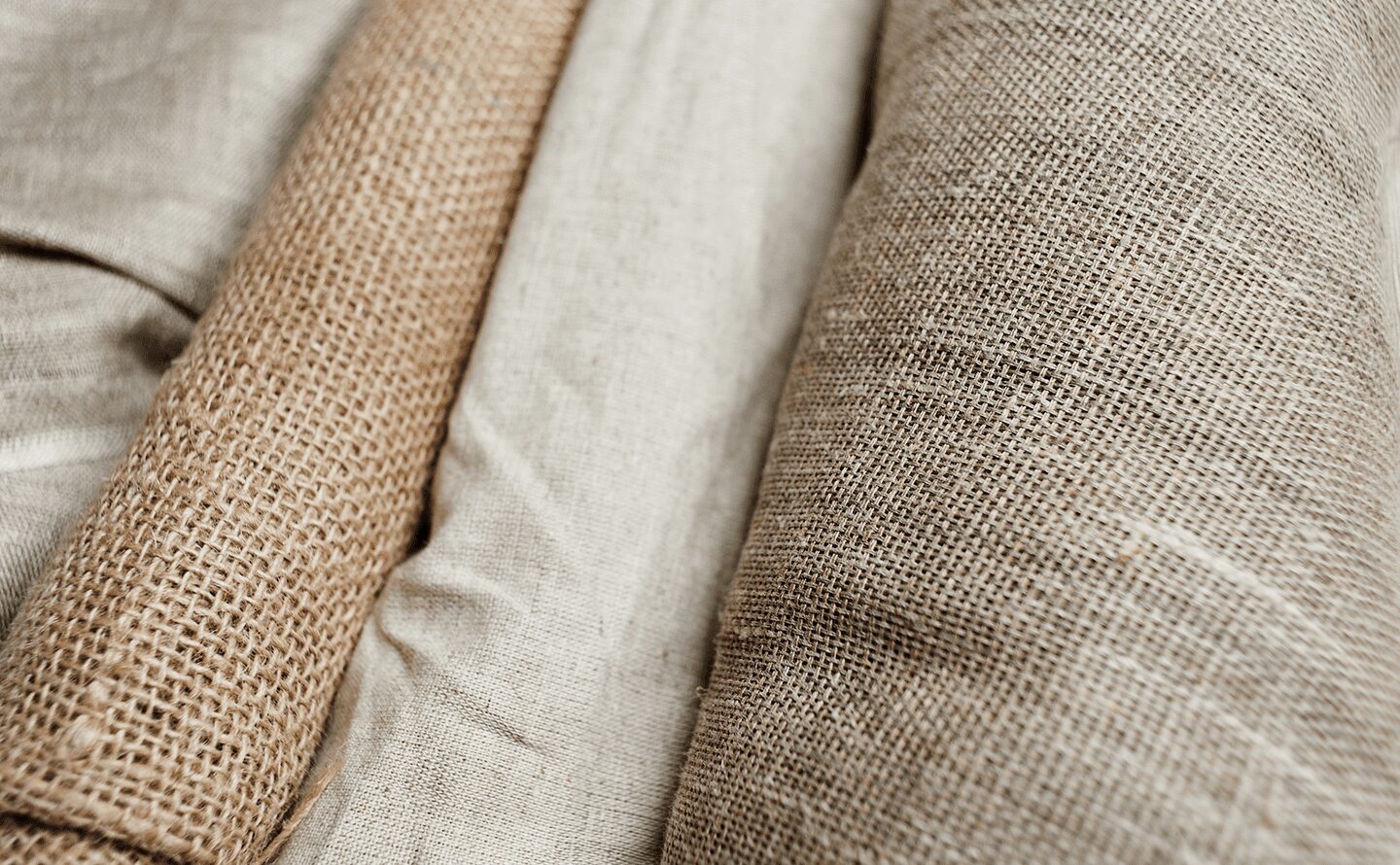 Jute and natural-fiber material swatches reviewed before tote sample construction