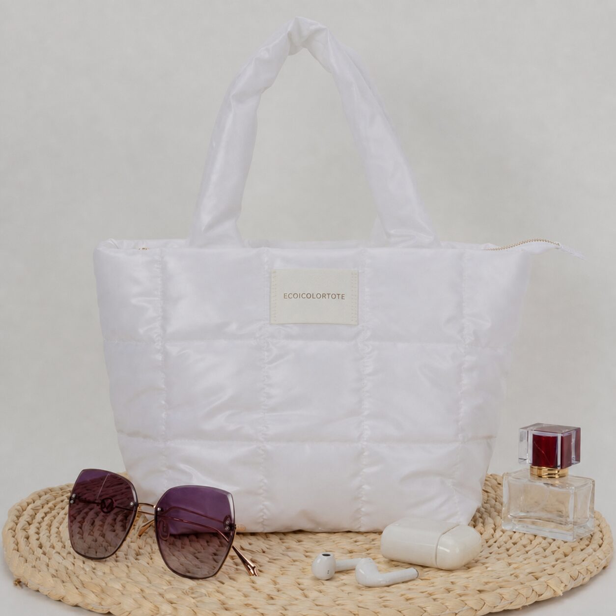 White quilted rPET tote with zipper and PU patch label for a 1,000-piece German brand order